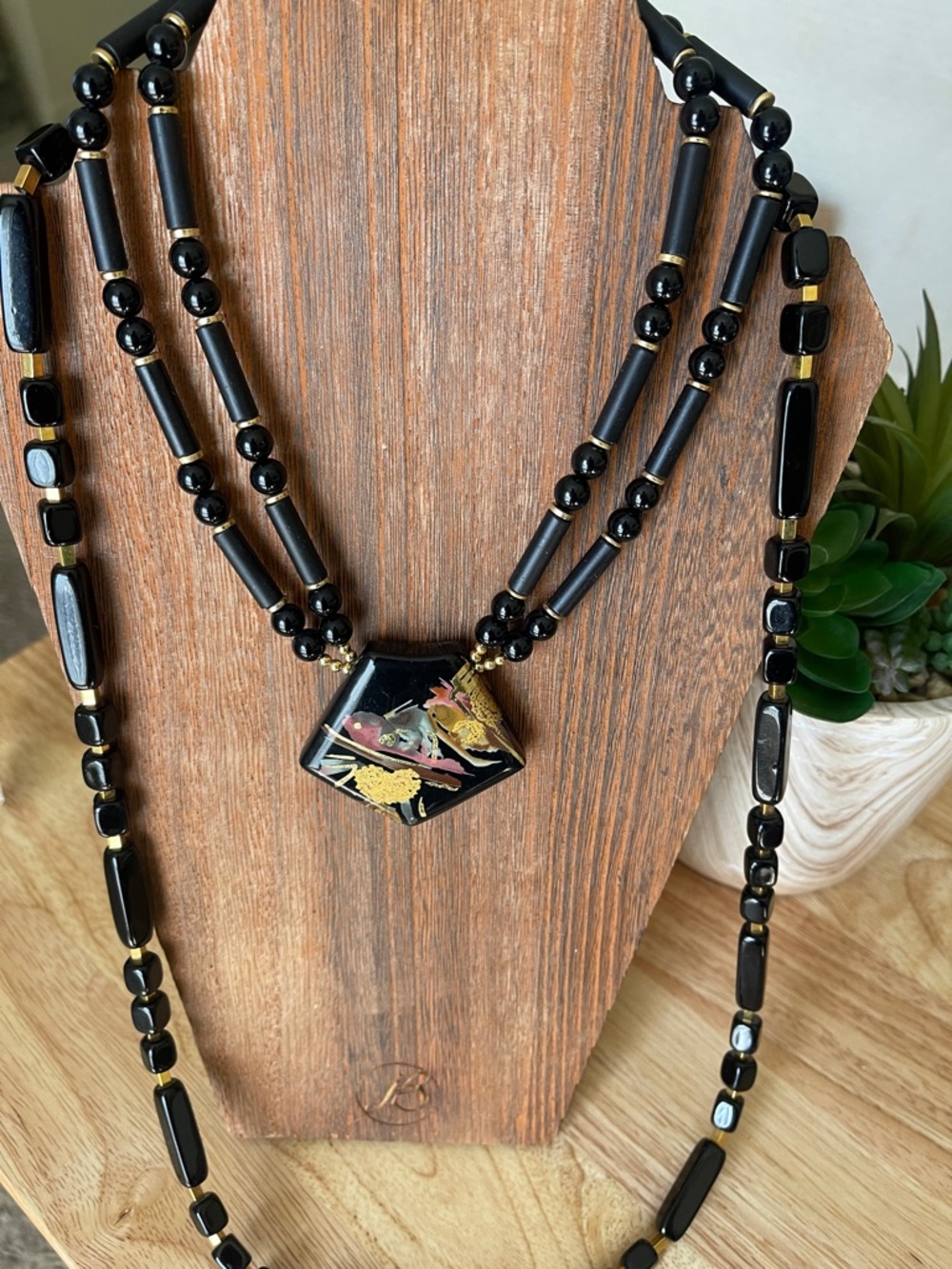 2 Trifari Black Beaded Necklaces, one  with Hexagon Floral Pendant.